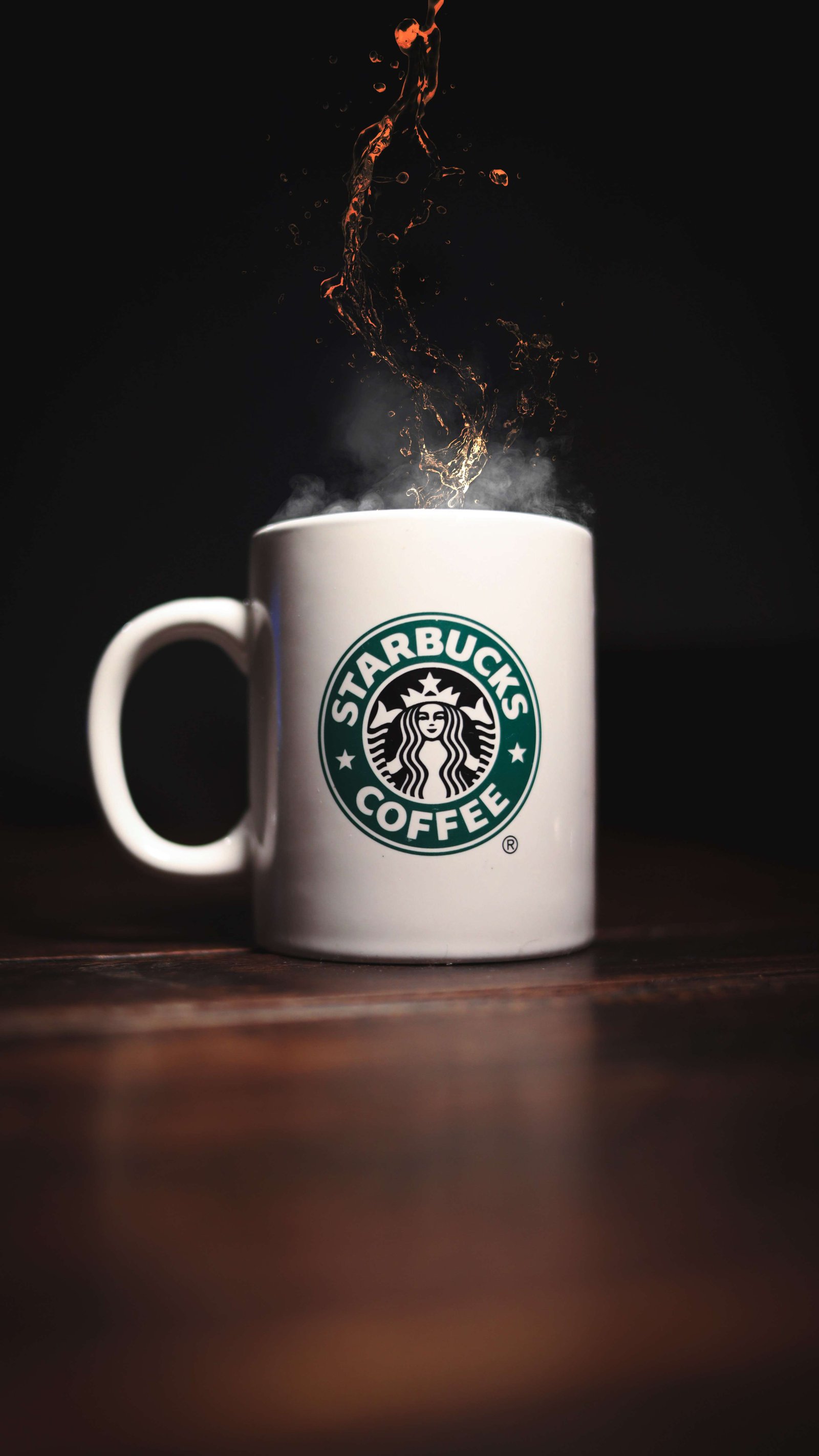 A cup of Starbucks Coffee placed on the table