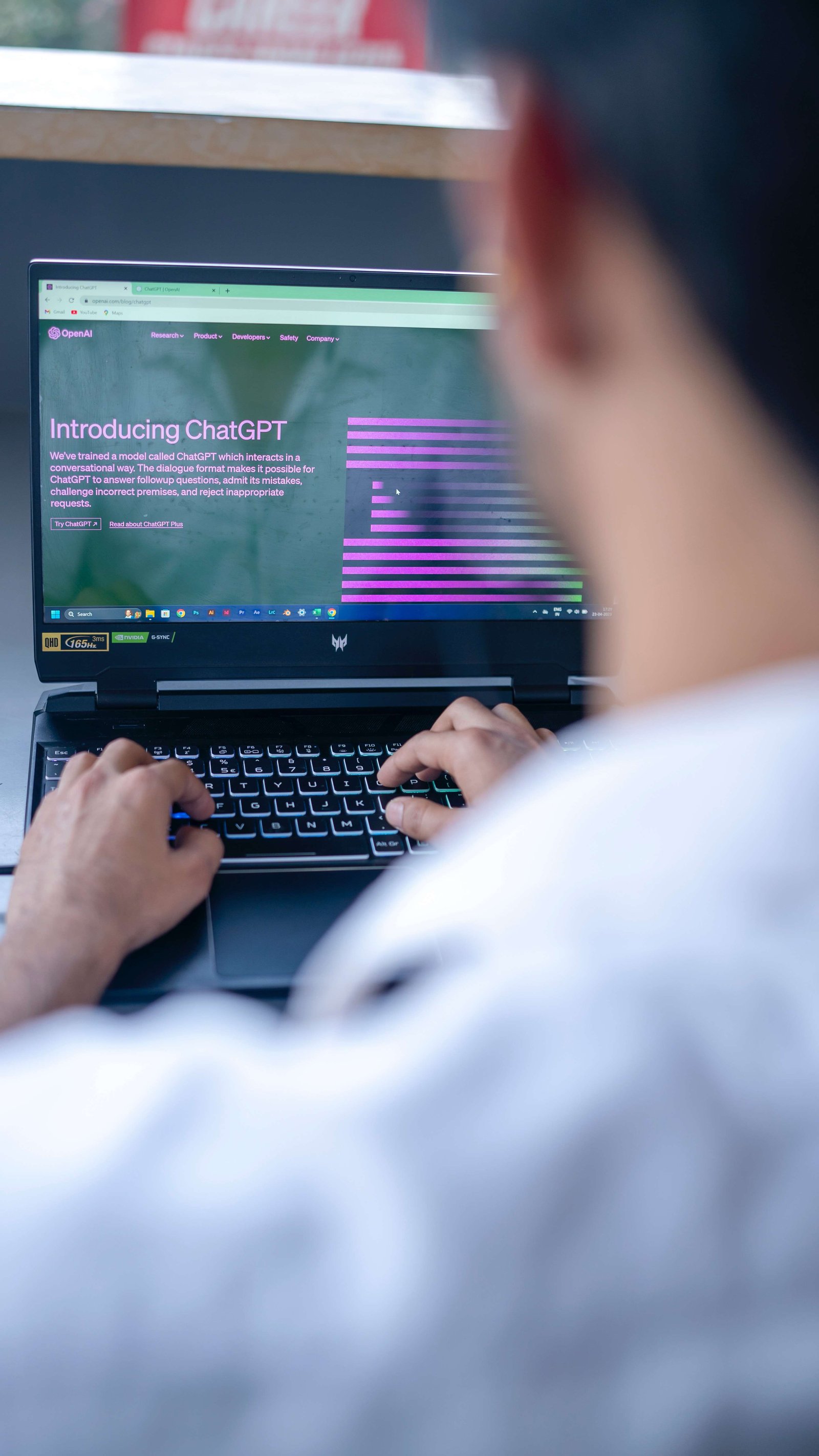 A man using ChatGPT on laptop