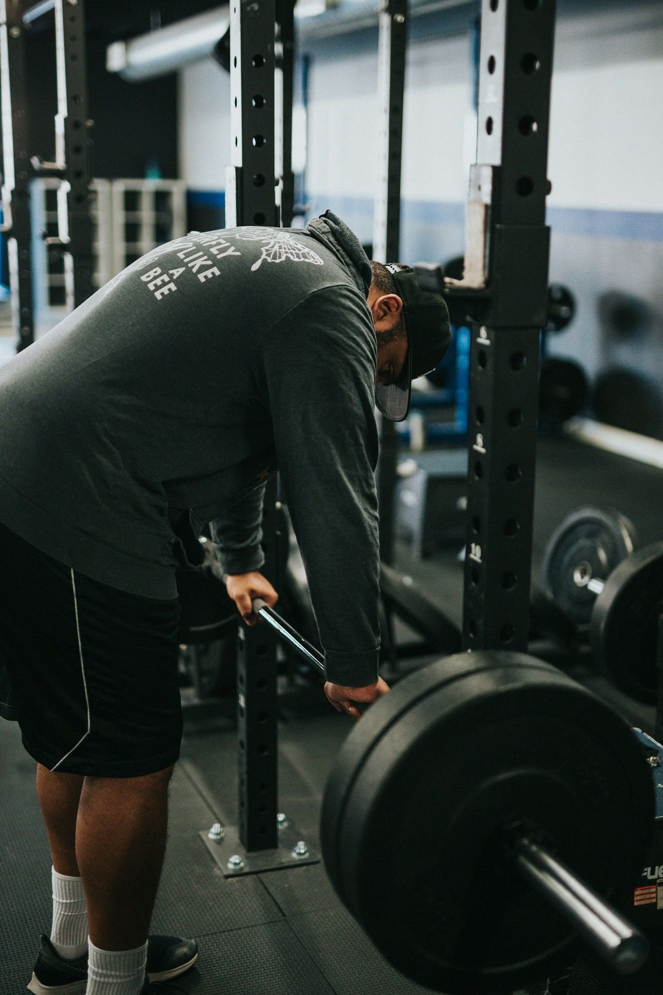Tense man deeply concentrated while performing a strenuous exercise with Gympass membership Tense man deeply concentrated while performing a strenuous exercise with Gympass membership